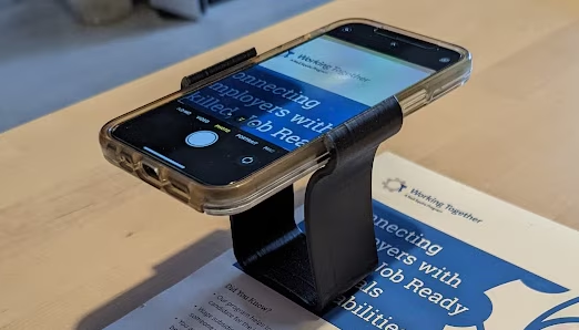 13) Smartphone Magnification Stand -  Holds your smartphone steady above the page so you can use your smartphone as a magnifier to see details more clearly.