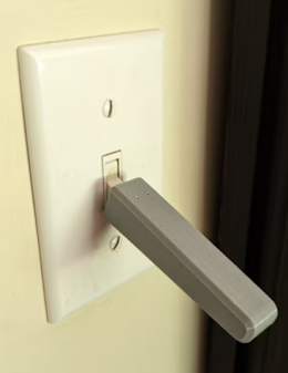 2) Light Switch Extension Lever - Extends the light switch arm, making it easier for those with arthritis, limited grip strength, or finger dexterity to flip lights on or off.