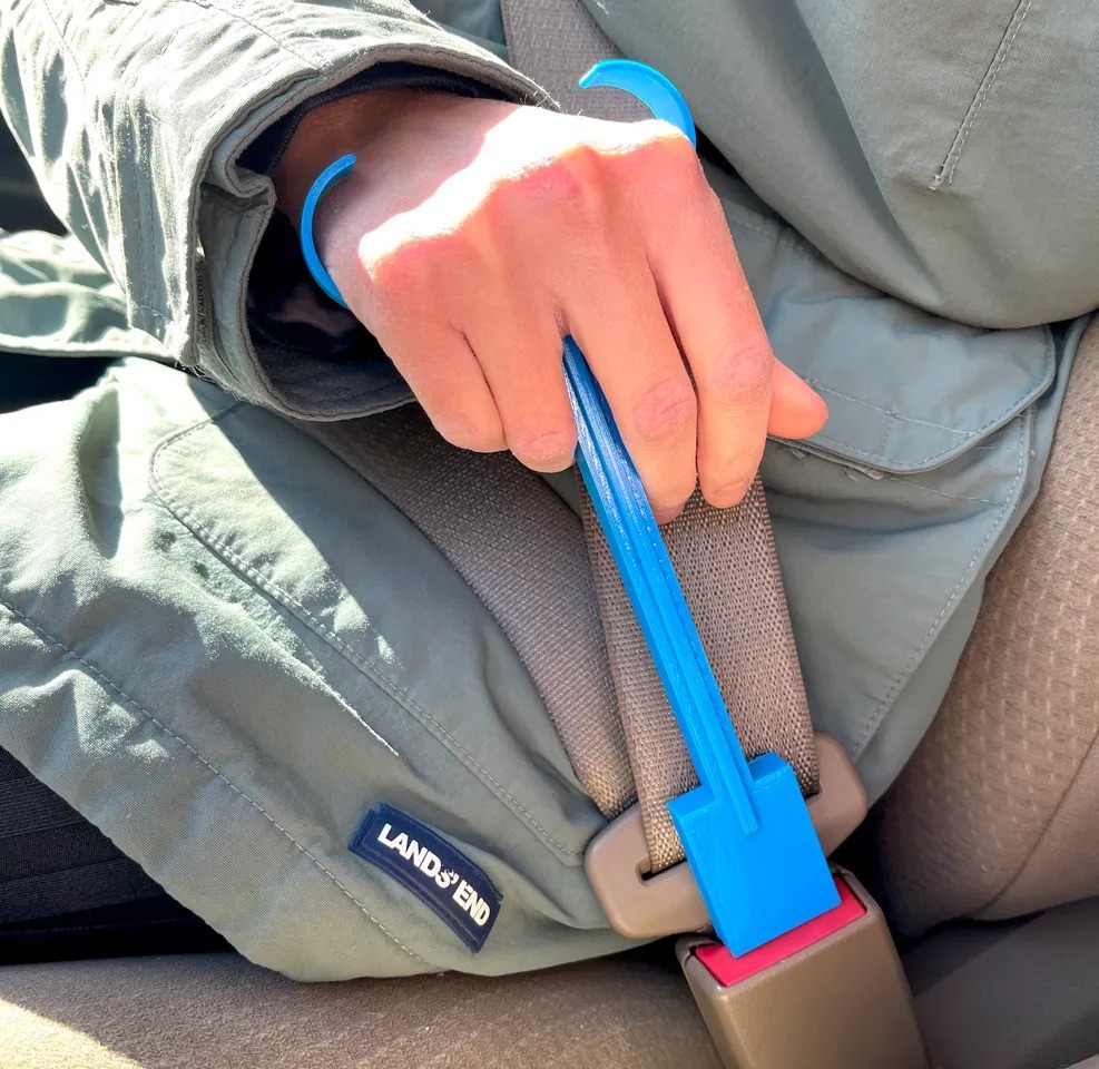 14) Seatbelt Release Aid - Helps to reach and press the release button on car seatbelts.