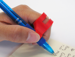 9) Vertical Finger Pen Holder - A small accessory that slides onto a finger to help hold a writing utensil. It is useful for those with gripping issues, but who still have movement in their wrist or hand. This device can be used on the index, middle, ring, or pinky fingers.