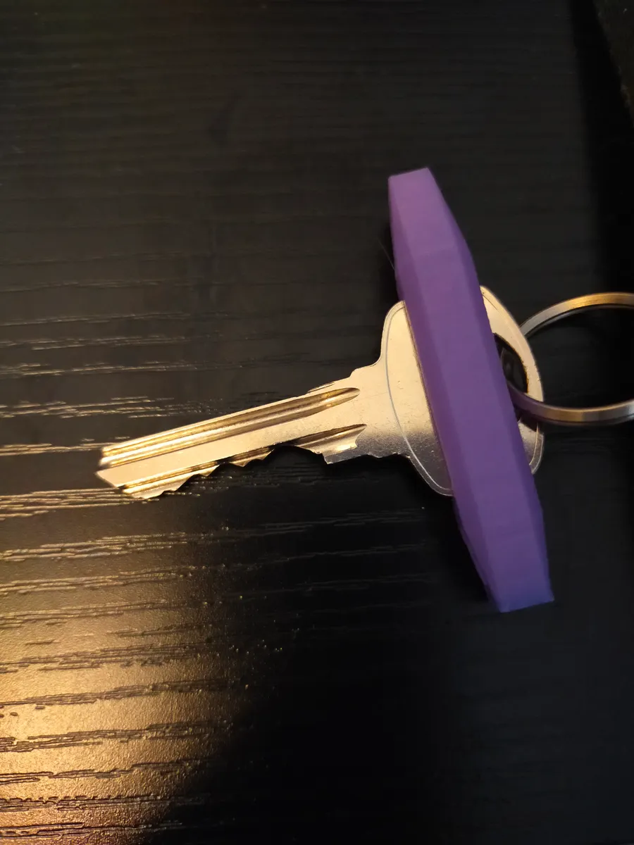 3) Key turner - For people with arthritis or other disabilities to help grasp their keys better. The key turner fits most standard keys. It has two holes to hang from a key chain.